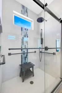 Modern walk-in shower with glass enclosure in Colorado Springs bathroom remodel